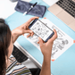 woman scanning smart whiteboard doodles to the cloud