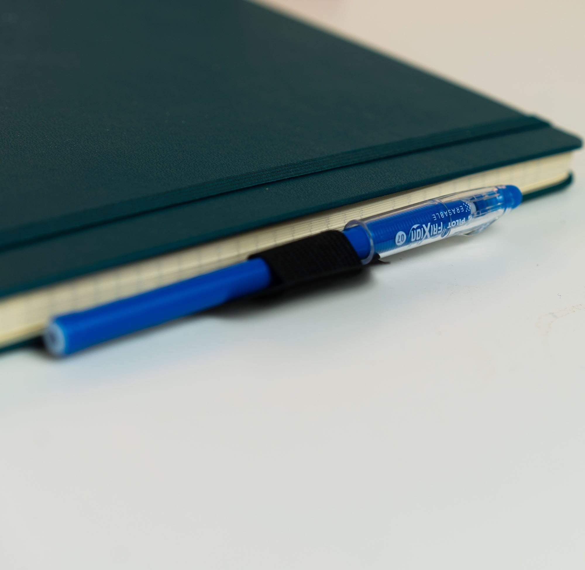 Rocketbook pen station attached to a notebook